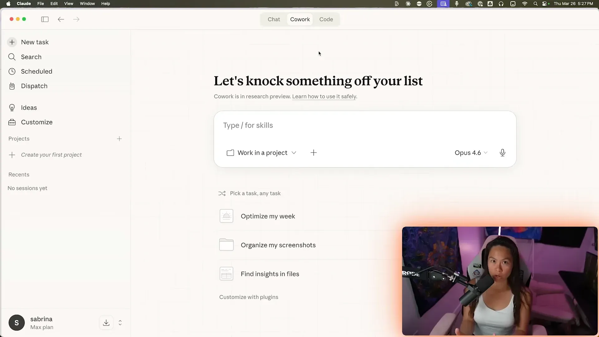 The Claude Cowork task view with the task box, a project selector, and suggested starter tasks like organizing screenshots.